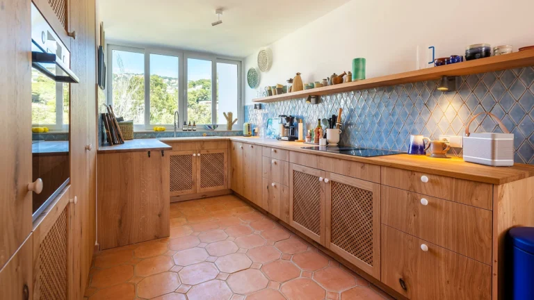 These rustic-Mediterranean inspired kitchens reflect the personal vision of a client with a strong sensitivity to noble materials and traditional finishes.